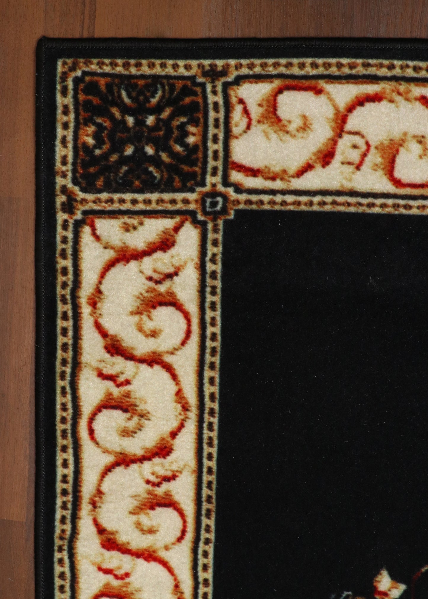 Majestic Black Area Rug with Antique Pattern and Cream Border Detailing
