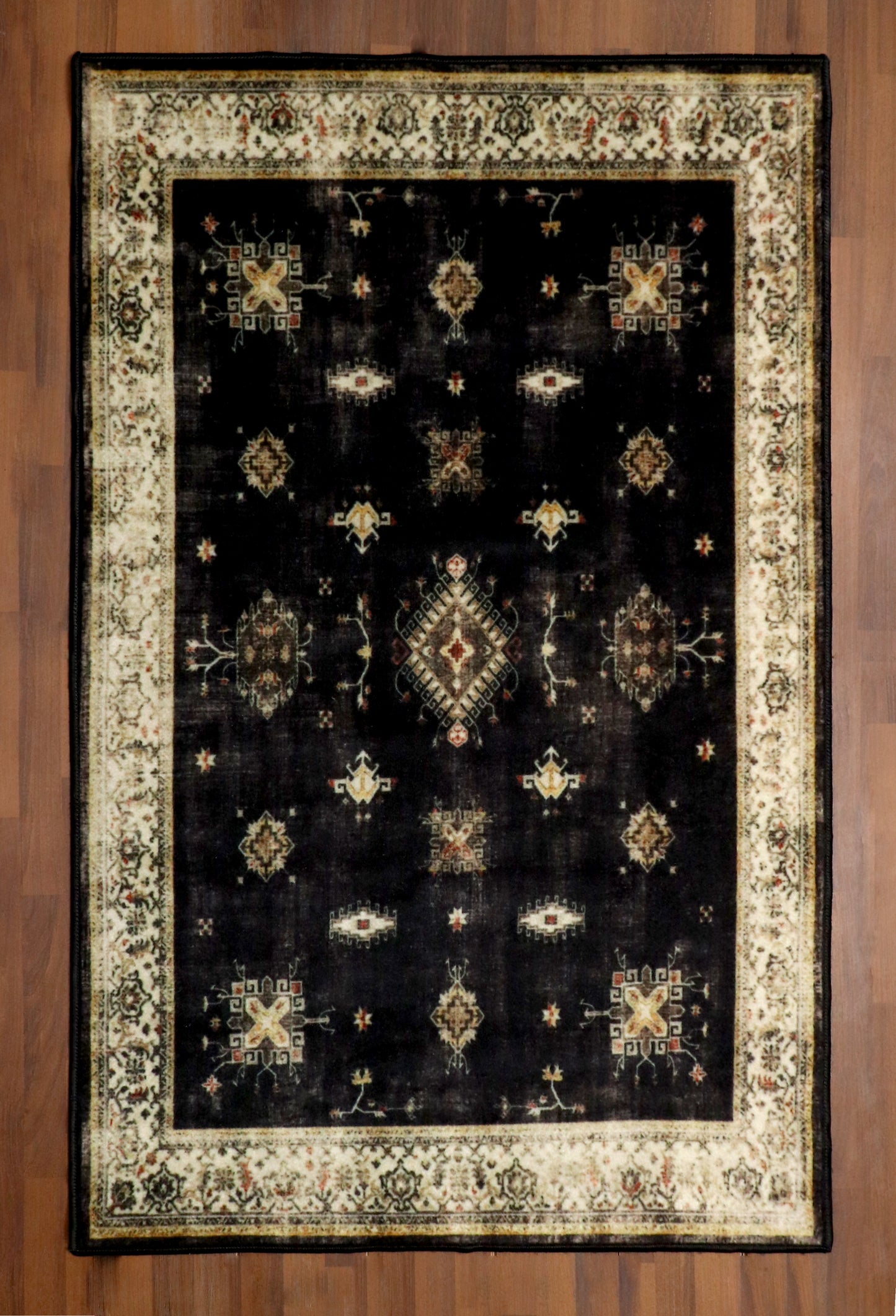 Vintage Black Rug with Cream Border & Intricate Pattern