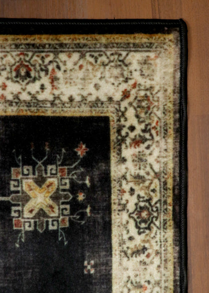 Vintage Black Rug with Cream Border & Intricate Pattern