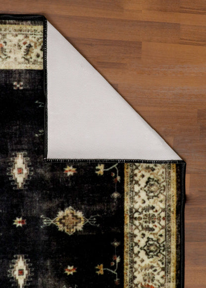 Vintage Black Rug with Cream Border & Intricate Pattern