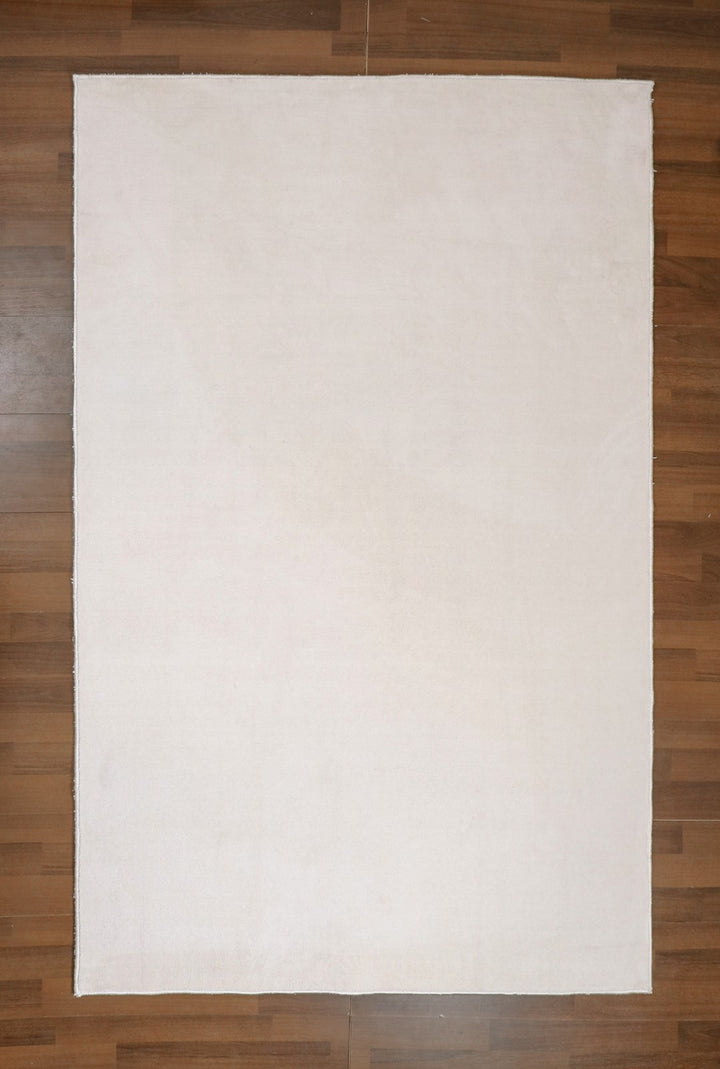 Beige Plain Print Non Woven Tufted Rectangle Rug with Doted Back For Everyday Use